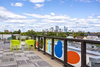 Patio with a view of the city skyline at Track 29 Apartments, Minneapolis, 55408